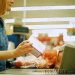grocery-clerk-checking-out-grocerie
