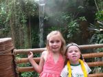 The kids pose in front of the waterfall
