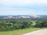 Enchanted Rock in the distance.